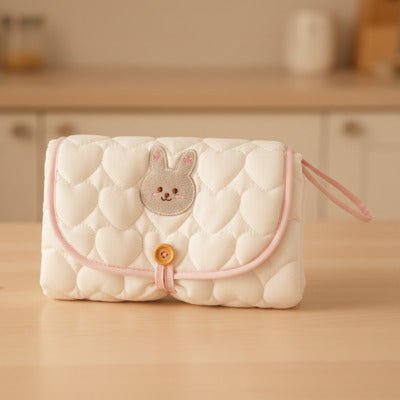 tapis à langer nomade lapin table