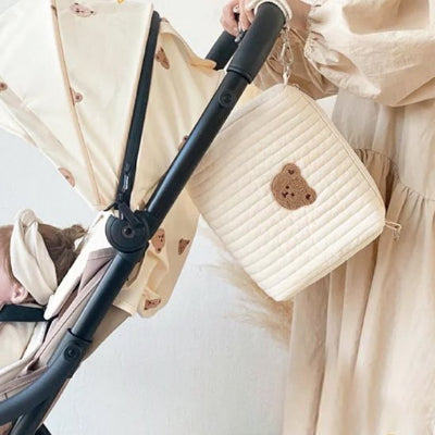 Trousse de toilette bébé accroché un côté poussette